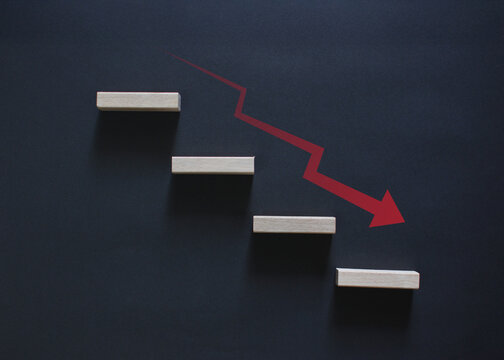 Red business graph with down arrows indicates financial losses and declines and marketing failures.