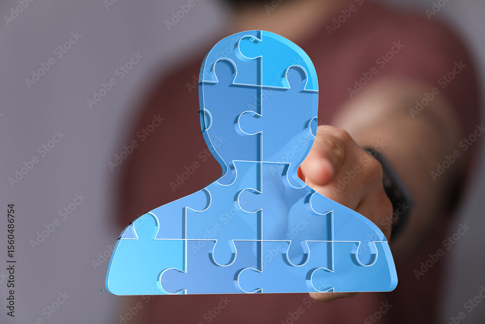 Poster abstract image of a person made of puzzle pieces, symbolizing teamwork, collaboration, and unity.