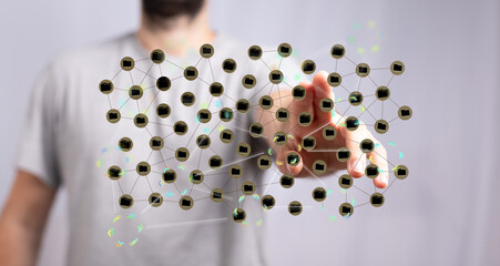 Person touching a holographic network of files, illustrating data connection and management.