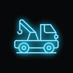 Blue neon sign depicting a tow truck is glowing on a dark background