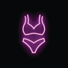 Obraz premium Bright pink neon sign is glowing in the dark, showing a two piece swimsuit