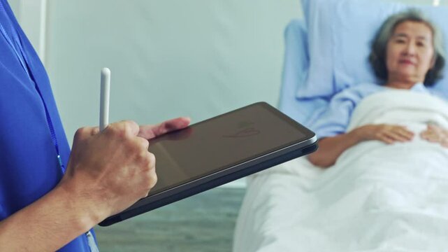 Female doctor checkup asks and records the symptoms female patient while she is being treated in a hospital bed in a friendly manner which makes the patient feel relaxed.
