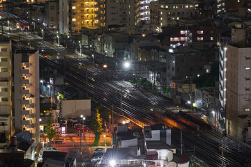 Tokyo Rail Tracks at Night – Urban Railway and Residential Lights in Japan