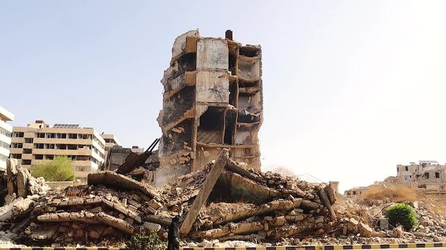 War torn building in Aleppo stands as a haunting memory of Syria &rsquo;s long conflict. Life slowly returns to the damaged neighborhood near the historic Aleppo Citadel, once bustling with people, culture