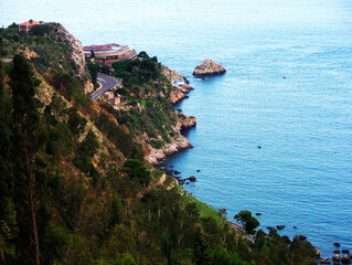 Stunning aerial view of Taormina s coastline in Sicily, where vibrant blue Mediterranean waters...