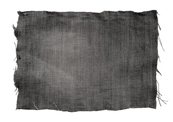 Piece of black torn denim on a white background. Denim texture
