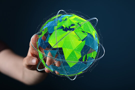 A hand holds a digital 3D model of Earth, illustrating global connectivity and networking.