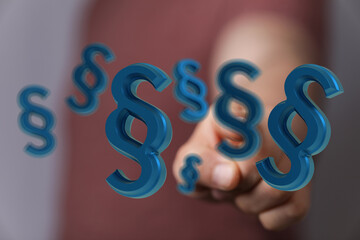 3D rendering of paragraph symbols floating near a hand.  Perfect for legal, law, and justice...