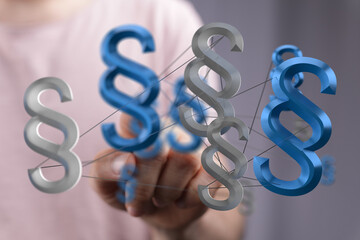 Abstract image of interconnected paragraph symbols representing legal network, law, and regulations.