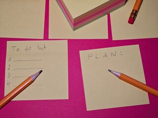 The famous yellow sticky notes with notes of things to do,
