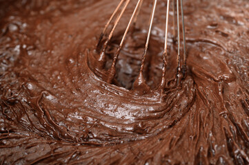  preparing chocolate cake, mixing ingredients