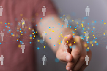 Person interacting with a digital network of connected people, illustrating global communication...