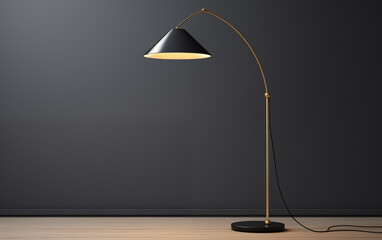Black and gold arc floor lamp illuminating a room against a dark gray wall