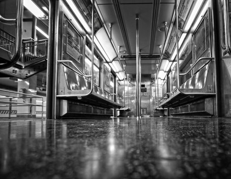 Black and white interior of a New York Subway car