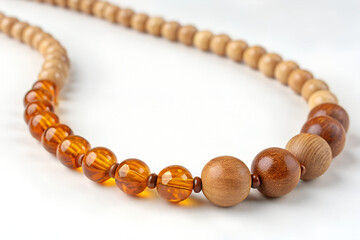 Wooden and Amber Beaded Necklace on White Background