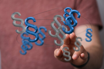 Abstract 3D rendering of interconnected paragraph symbols, representing legal network, law, and...