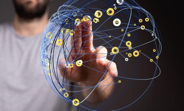 Abstract image of a hand interacting with a digital network sphere, symbolizing global connectivity and data interaction. - Powered by Adobe