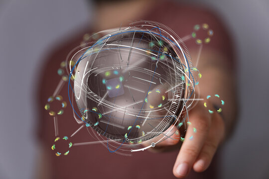 High-tech image showing a person interacting with a 3D digital globe, representing global network connections and data flow.