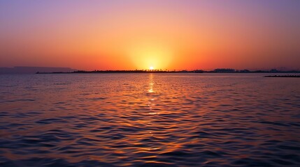 Fototapeta premium Dramatic Red Sea Sunset with Fiery Crimson Sky Reflecting on Turquoise Waves, Egypt Coastline Silhouette Under Volcanic Cloud Formations, Empty Horizon Composition