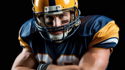 A determined American football player in a blue and yellow uniform, ready for action against a black background