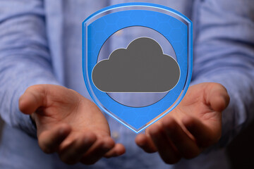 Image of hands holding a digital shield protecting a cloud, symbolizing secure cloud data.