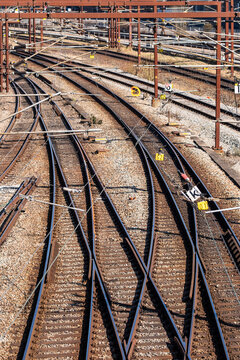 Overhead view of converging railway tracks with rusty steel elements, Copenhagen, Denmark, industrial geometry and urban infrastructure pattern