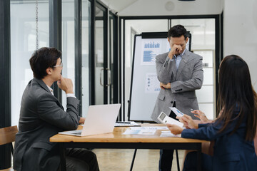 Failed Presentation Blues: A man stands defeated during a presentation, surrounded by colleagues in...