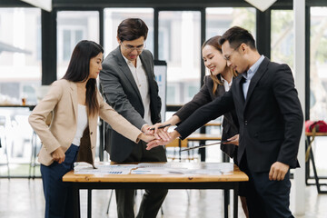 Teamwork Synergy in the Workplace: A diverse group of professionals, united in their collaborative...