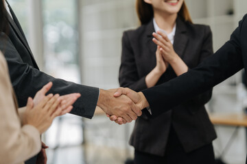 Business Handshake: A close-up shot of a business handshake between two professionals, as...