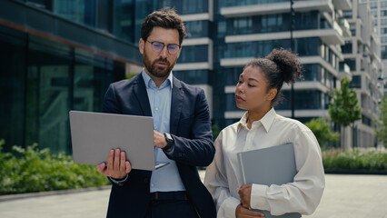 Multiracial business people walk in city multiethnic colleagues Caucasian businessman man male guy...