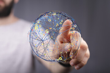 Person interacts with a digital globe, representing global networking and connectivity.