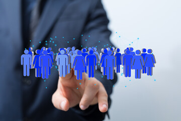 Image of a businessman interacting with a digital network of people, representing connection and...