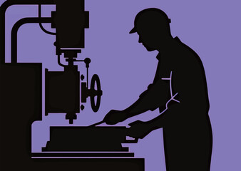 Silhouette of a male industrial worker operating machinery in a workshop.