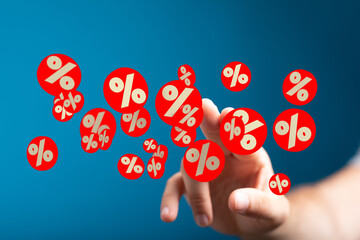 Image of a hand interacting with percentage symbols, ideal for discount, sale, and finance...
