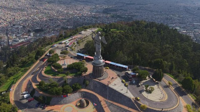Aerial view of the Virgin of El Panecillo statue in Quito, with the city sprawling below showing Ecuadorian tradition and Christian faith