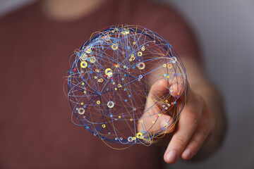 Person interacting with a digital globe, representing global network, connection, and communication.