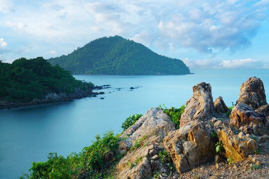 Majestic islands and rugged rocks frame the serene blue sea at Chanthaburi, Thailand, capturing tranquil coastal beauty under a soft sky - Powered by Adobe
