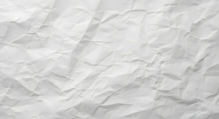 Delicate texture of crumpled white paper showcasing abstract folds and subtle shadows for artistic or background applications.