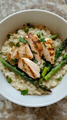 A delectable risotto, rich and creamy, features succulent grilled chicken slices and tender asparagus, served in a cozy Italian kitchen, inviting a warm culinary experience