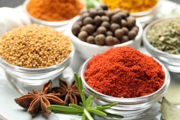 Many different aromatic spices on table, closeup