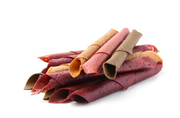Delicious fruit leather rolls on white background