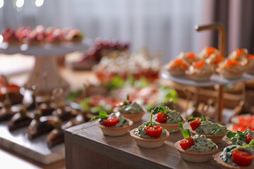 Buffet menu. Tasty stuffed tartlets on stand, closeup