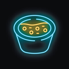 Neon sign showing a bowl of soup with croutons on a black background