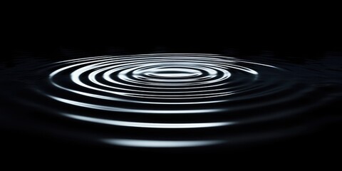 Concentric ripples on a dark surface