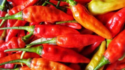 Red Hot Chilli Peppers' pattern, texture, and background. Close up. Landscape. A backdrop of Red Hot Chilli Peppers. traditional vegetable market. Group of Red Hot Chilli Peppers