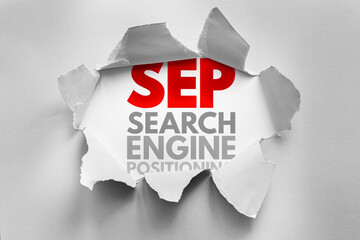 Torn paper effect revealing red SEP acronym above gray words Search Engine Positioning. Creative...