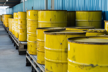 Waste facility depot with yellow storage barrels Generative AI