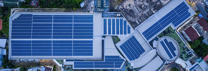 Solar roof, Solar on the roof, top view worker installing a solar cell on the factory roof, panels...