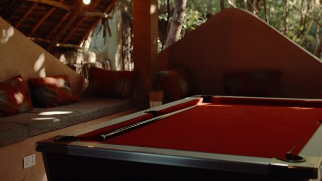 Pool table and cue at a hotel bar