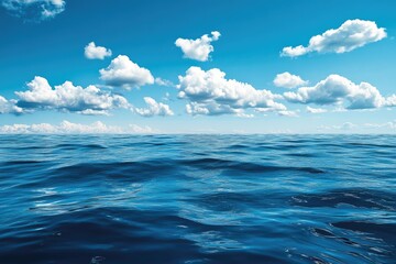 Obraz premium Vast expanse of deep blue ocean meets a clear, sunny sky dotted with puffy white clouds